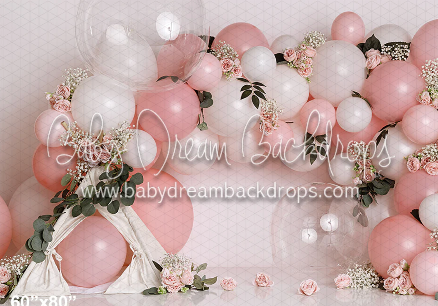 Pink balloon garland with white roses and silver accents creates an elegant backdrop for special occasions.