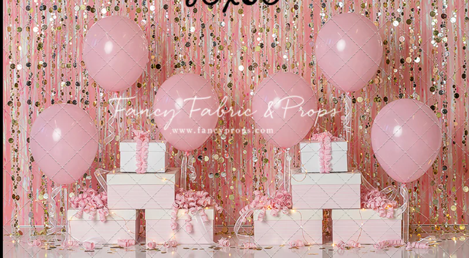 Pink and white party decorations with balloons, presents, and a glittery backdrop create an elegant celebration setting.