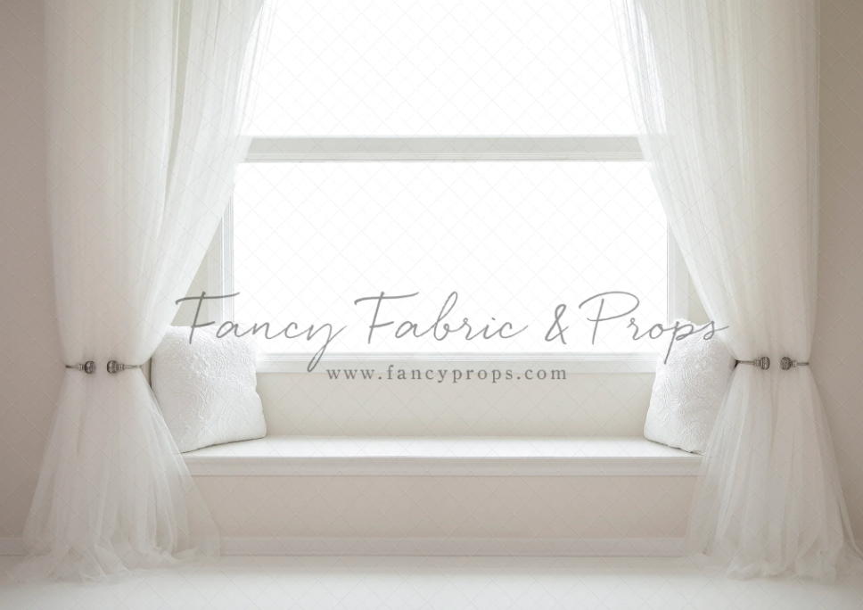 Bright window with flowing white sheer curtains and wooden rod in natural light photography setup.