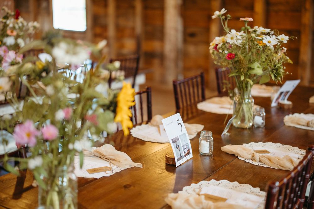 elegant wildflower table decor at Blossom Grove Barn, Salisbury New Brunswick wedding photographer, romantic wedding photography experience