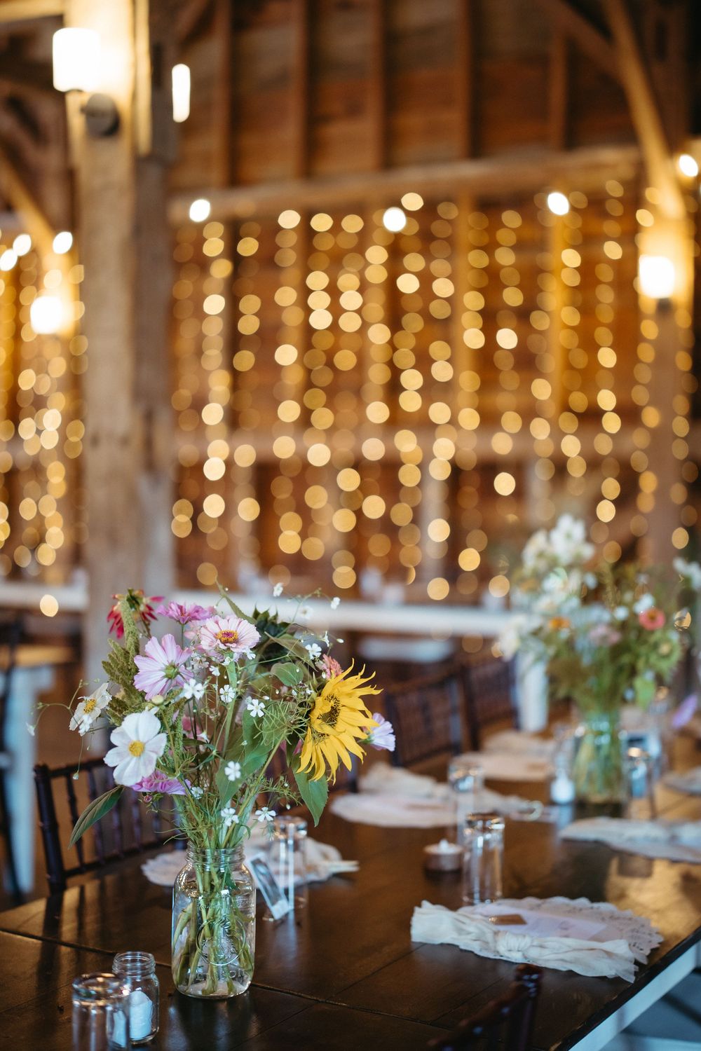 wildflower themed wedding decor at Ticklebelly Hill, fall wedding in New Brunswick wedding photography with two photographers, freelance