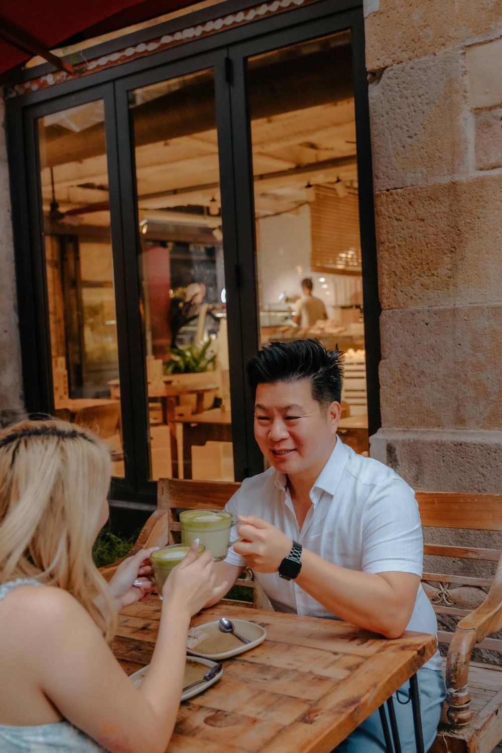 Ellis sipping a matcha latte after a fun photoshoot in the Old City.