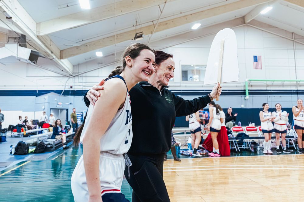 Daughter and Mother walking together during Senior Night