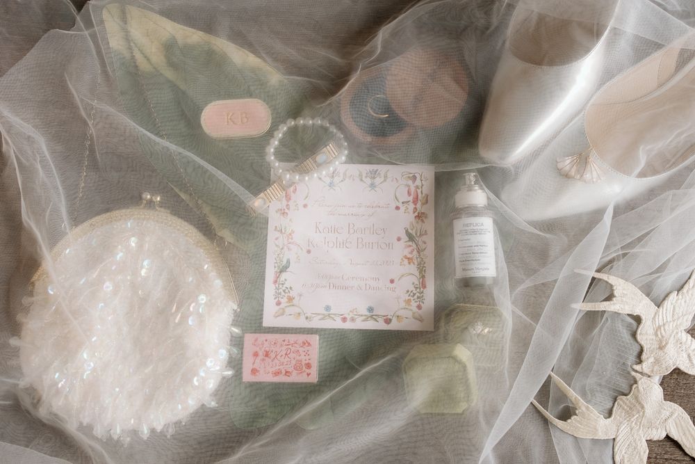 Wedding detail flat lay including Lord of the Rings inspired ring box and elven leaf.