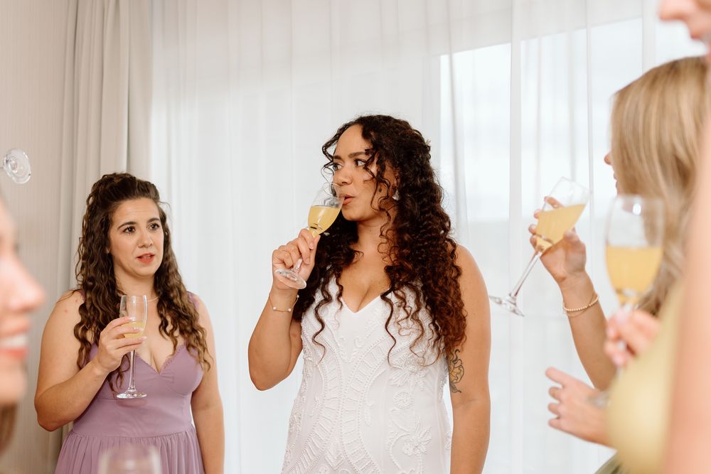 bride sharing a toast with her bridesmaids