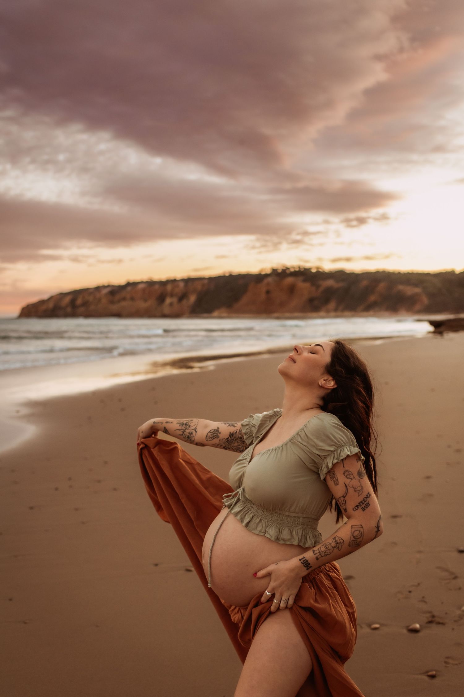 Photoshoot of maternity model at a Surfcoast Beach during sunset. Geelong, Australia