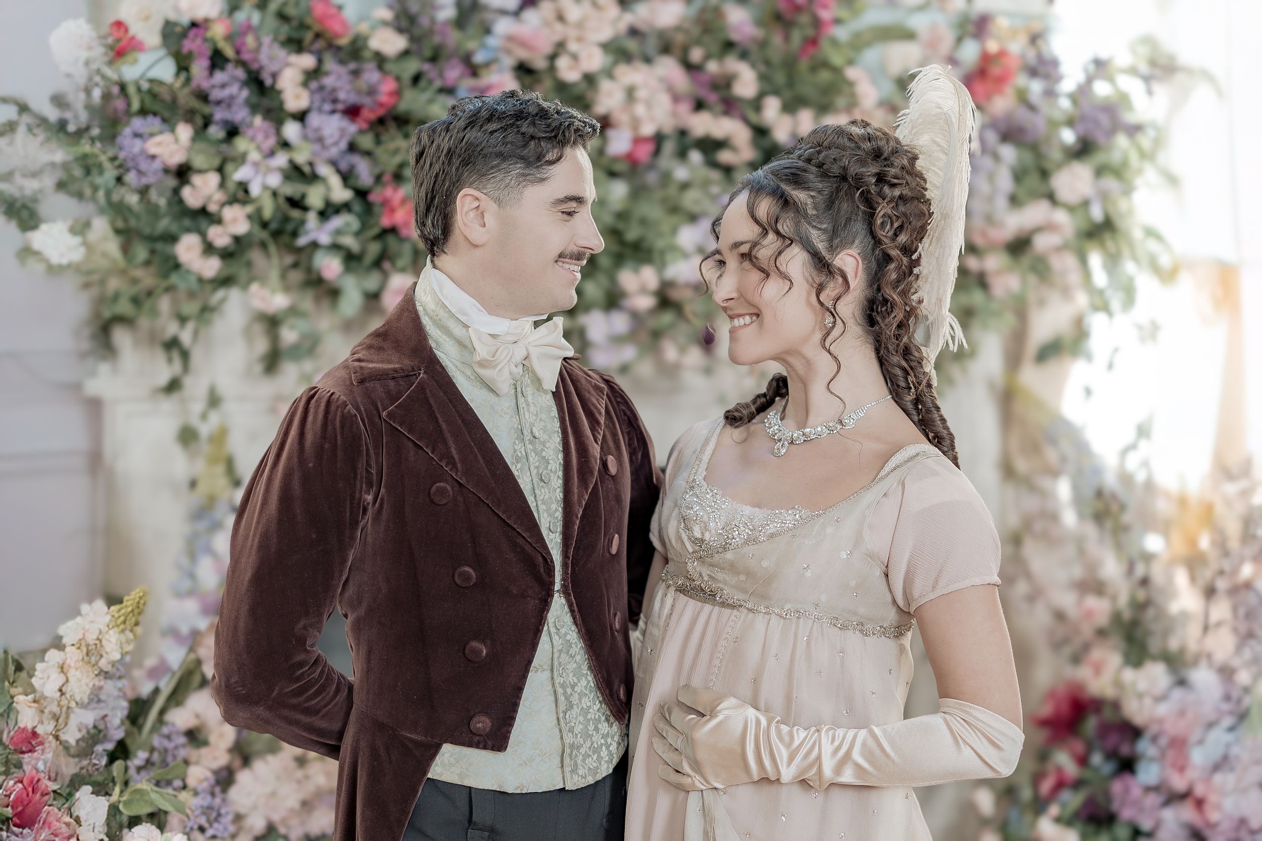 Bridgerton at Newark Town Hall in Nottinghamshire, photographed behind the scenes for the Netflix production. couple looking at each other.