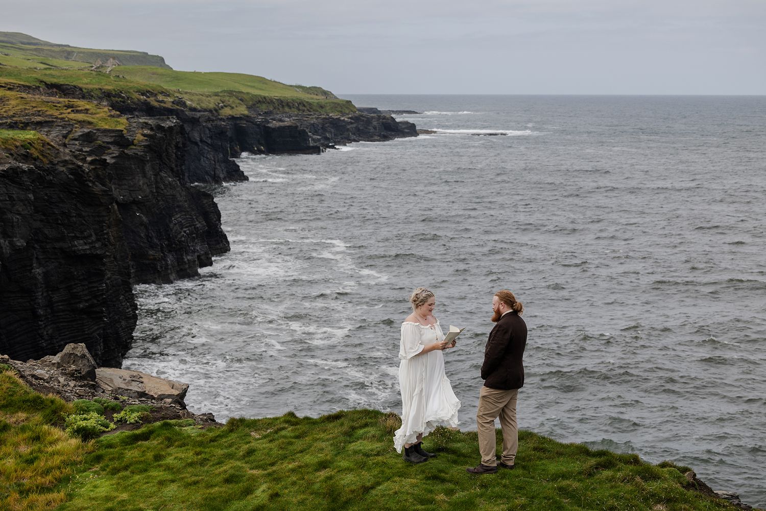 Bride and groom saying vows during coastal elopement ceremony along the Wild Atlantic Way