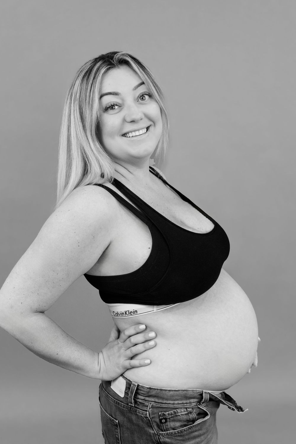 A series of black and white photos showing different poses in casual attire against a neutral background.