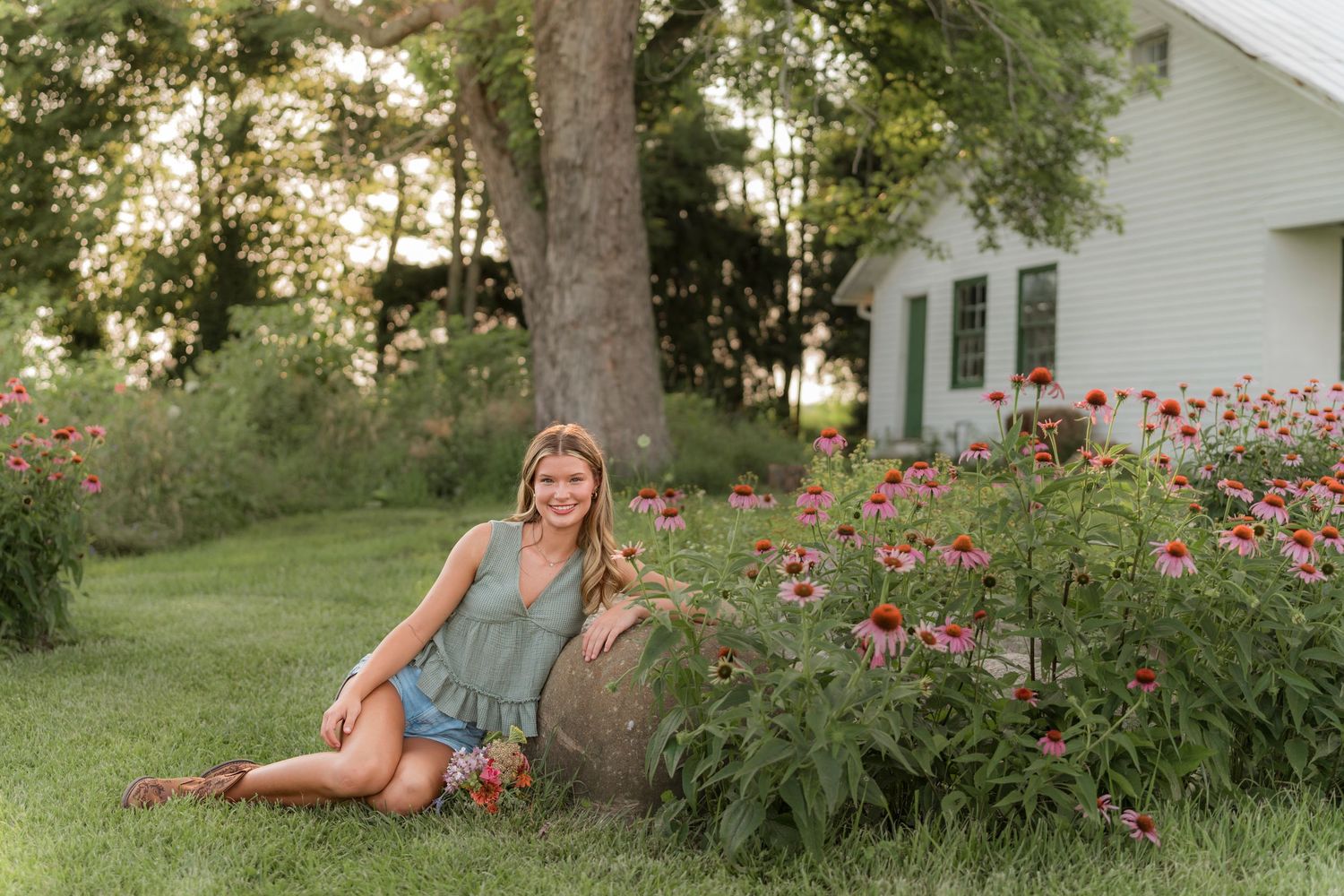 A collage of outdoor garden scenes with pink cosmos flowers and white house in the background during golden hour.