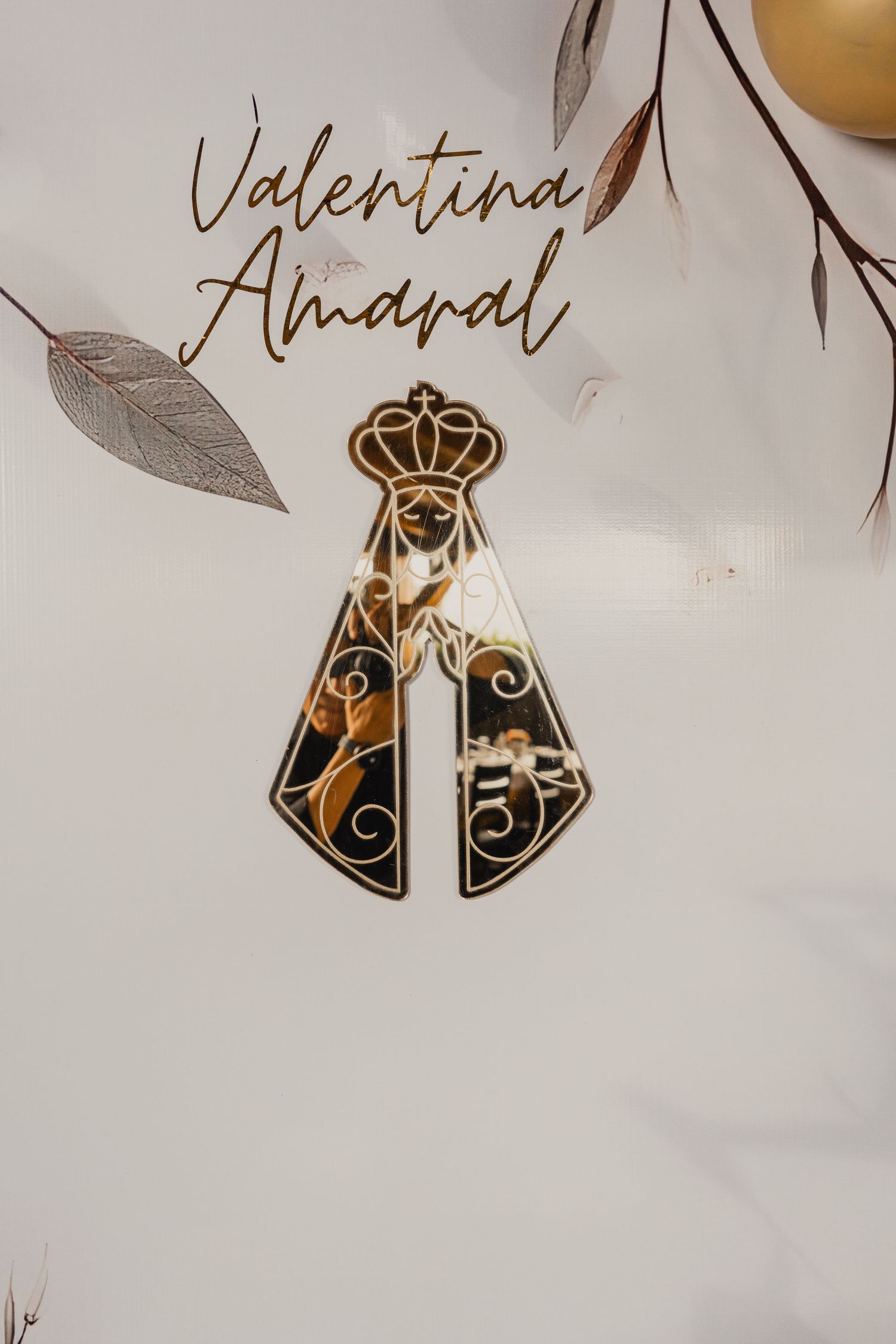 Elegant gold and black wedding place cards with crown designs and calligraphy names displayed on white background.