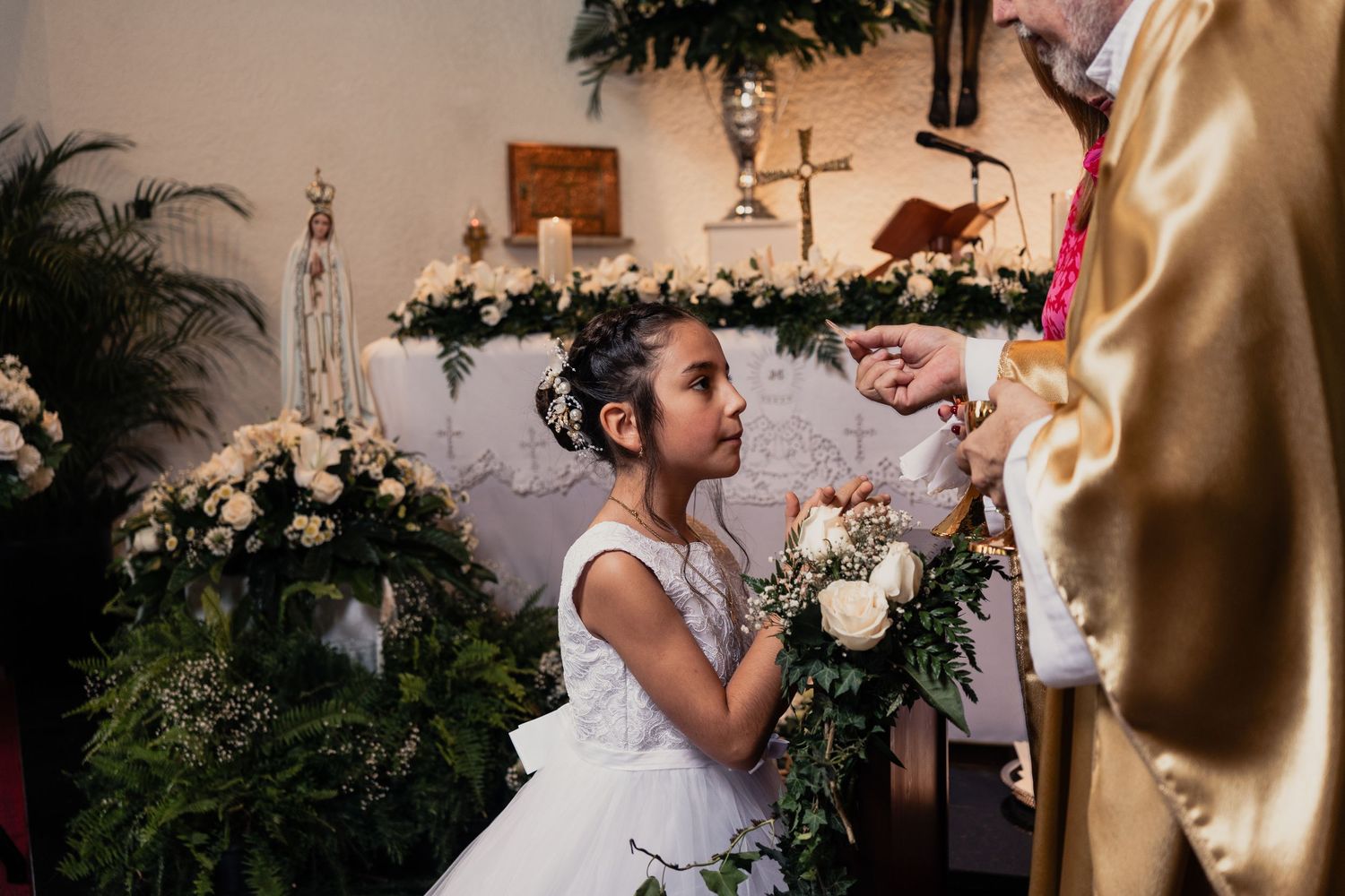 Joyful wedding celebration with guests dancing and embracing at an elegant reception venue.
