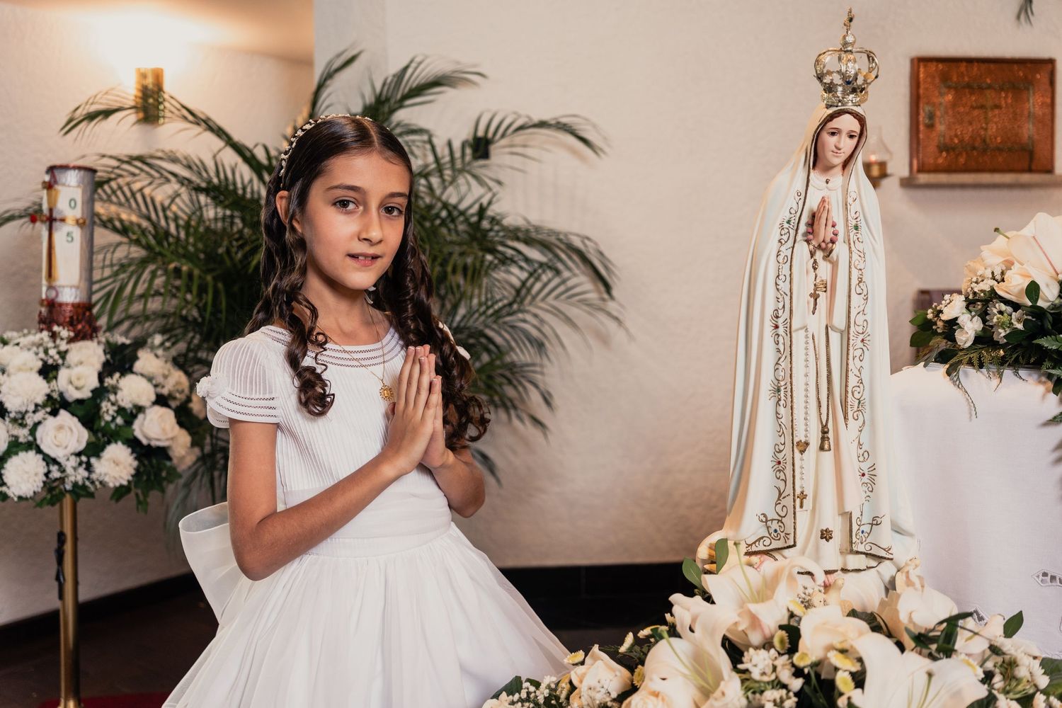 A collage of elegant wedding scenes with white floral arrangements, religious statues, and formal attire.