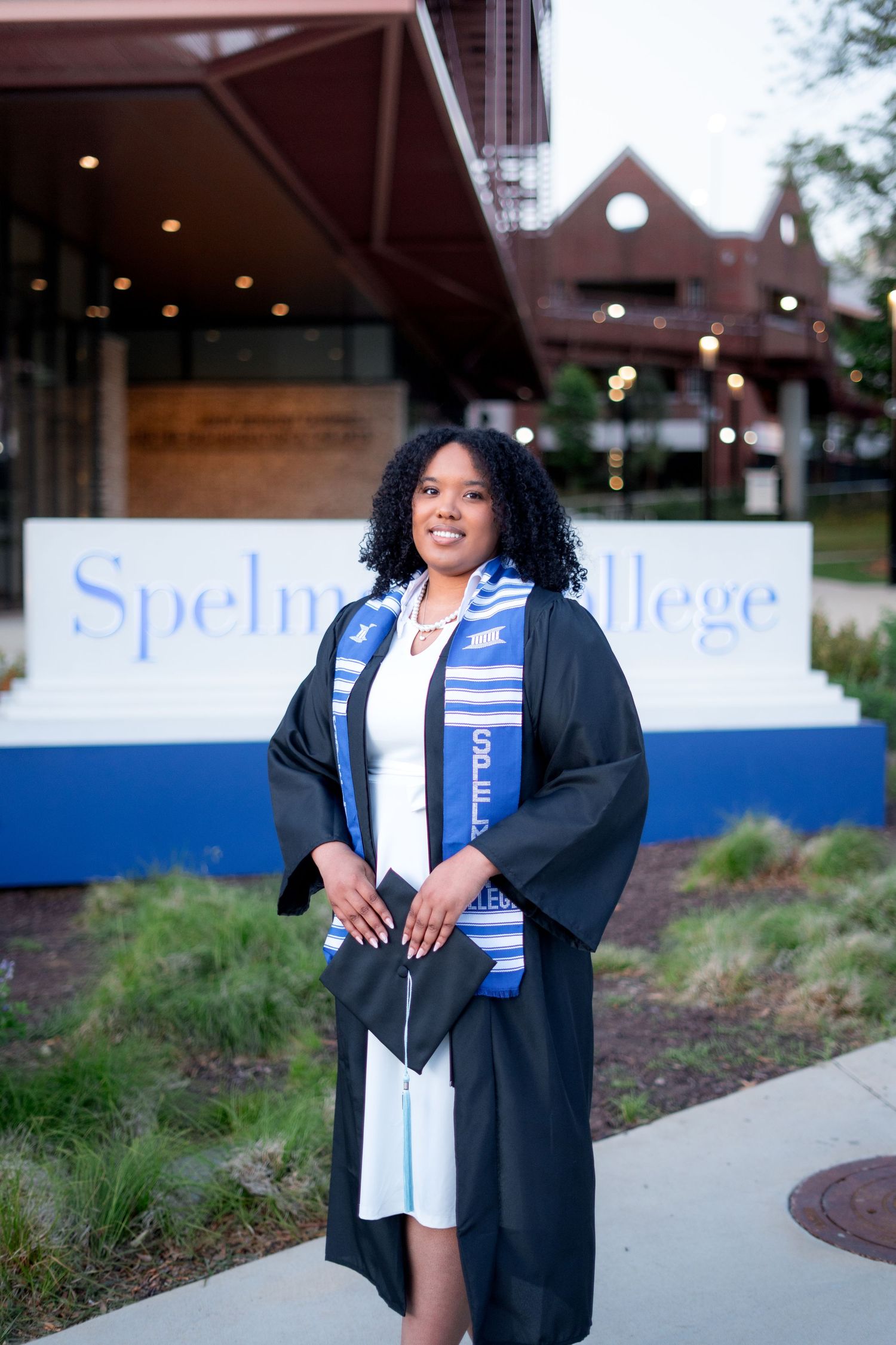 Spelman graduation photos in front of the iconic Spelman College Sign, one of the best spots on the Atlanta campus