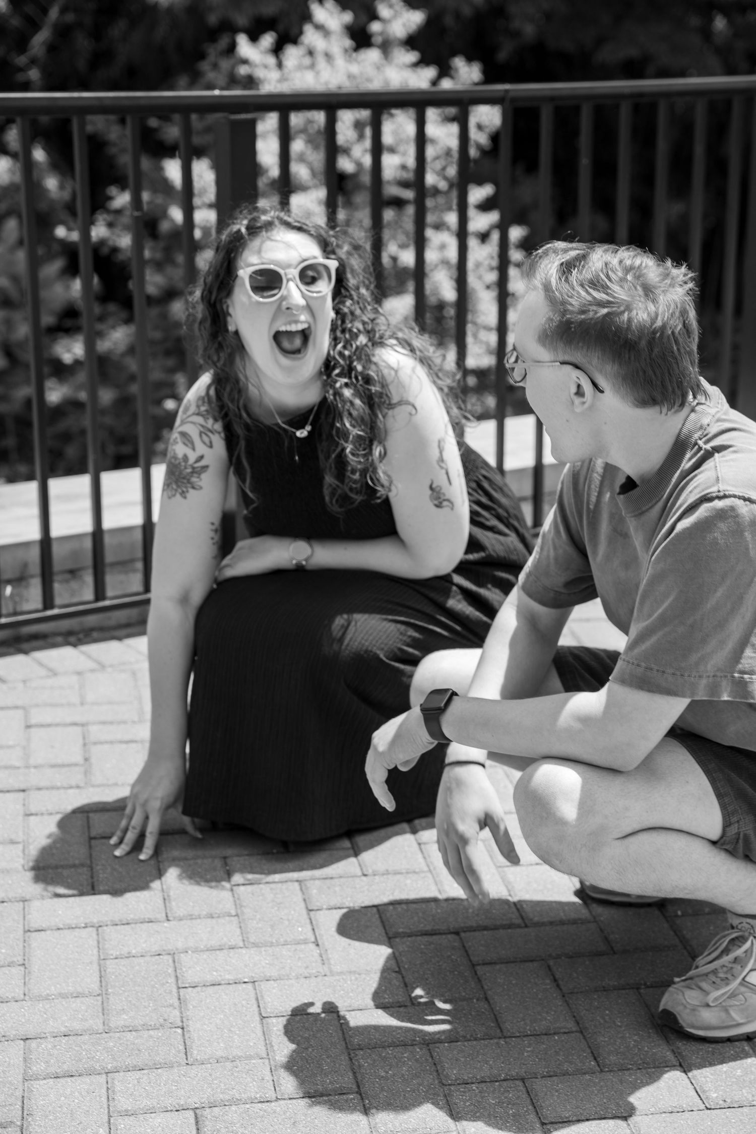 Teresa laughs in surprise as Julep the penguin steals the spotlight during their Cincinnati Zoo proposal experience.