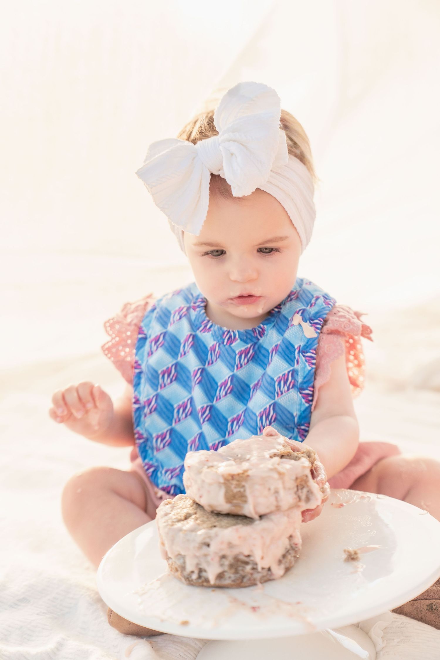 toddler girl cake smash one 1 year milestone outdoor photography, pink cake, conroe photographer