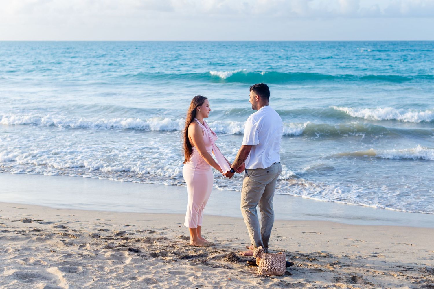 Man proposing to a woman at the beach in Isla Verde, Carolina, Puerto Rico.