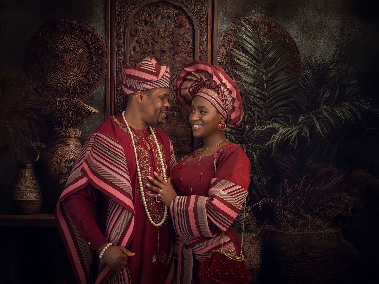 A series of artistic fashion portraits featuring someone in a maroon dress and pink striped headwrap against a dark background.