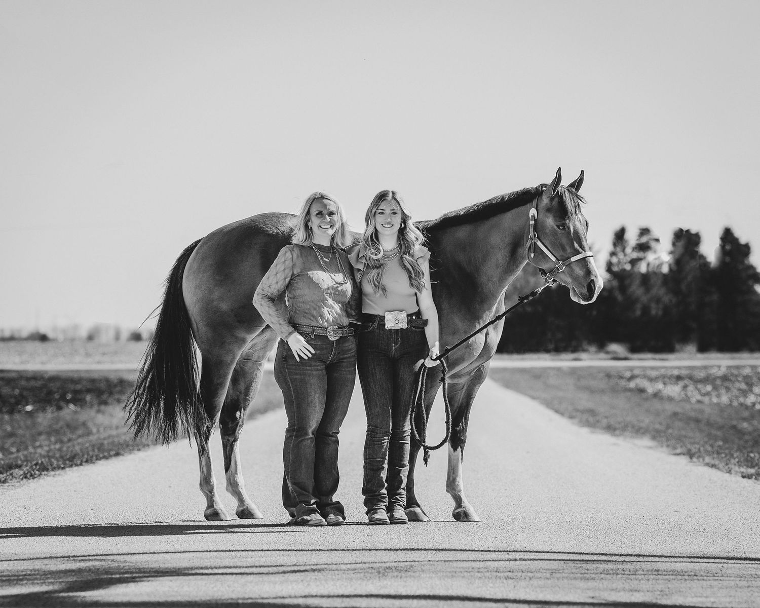 Senior and mom posed with their horse