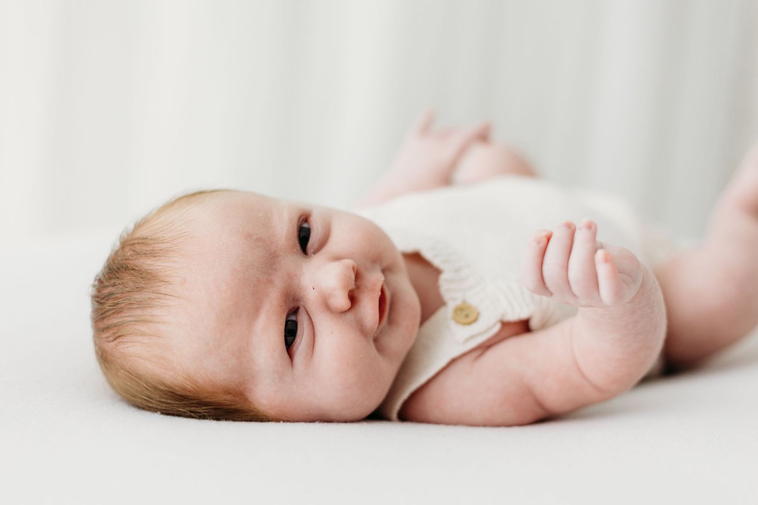 Baby portraits in Mapperley studio, Nottingham newborn photographer capturing peaceful first days with timeless style.