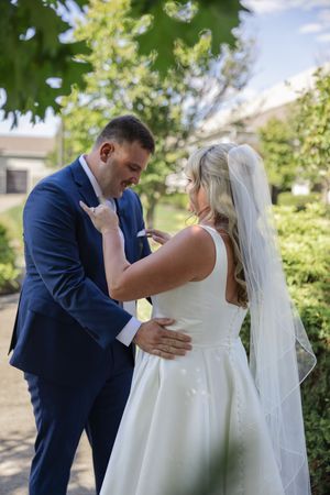 A series of romantic moments between newlyweds during an outdoor wedding photoshoot in a garden setting.