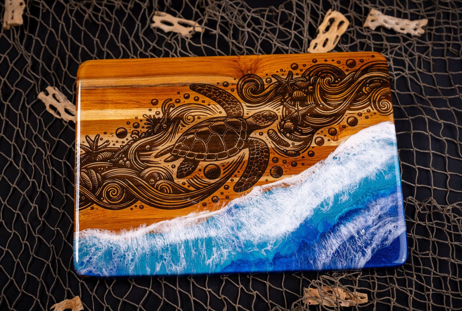 Handcrafted wooden serving board with resin ocean waves design featuring blue and amber colors in a beach-inspired pattern.