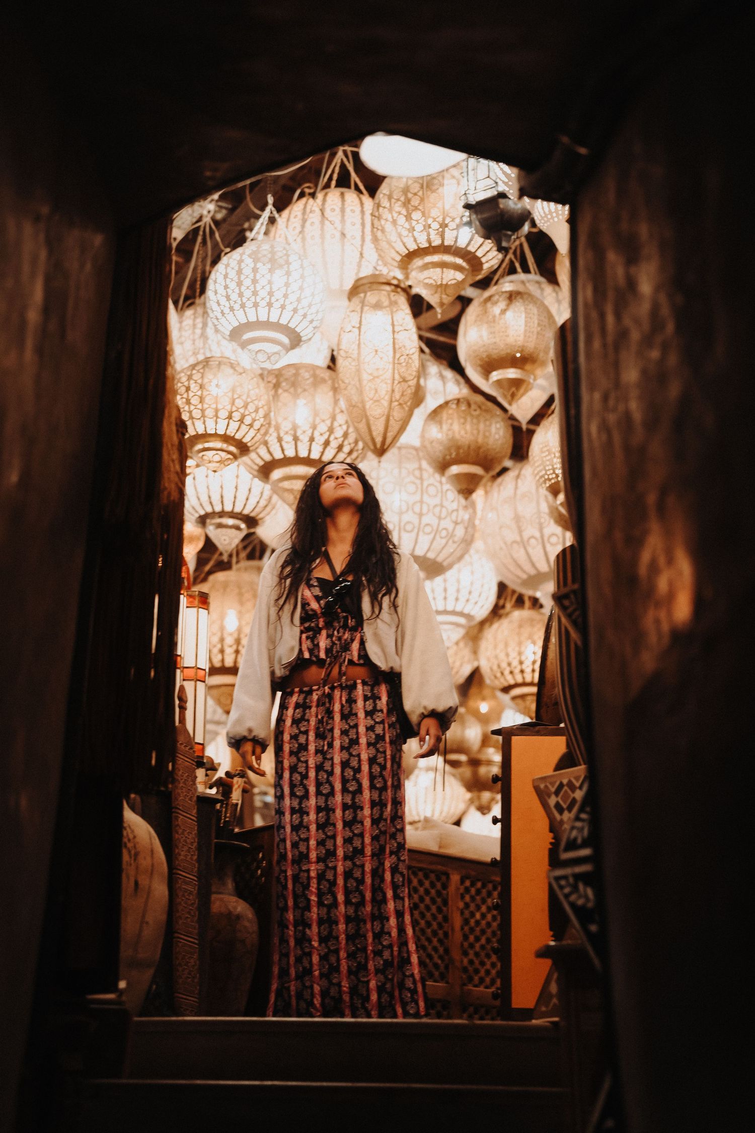 Illuminated decorative seashell lamps create a warm ambiance in a dark room.