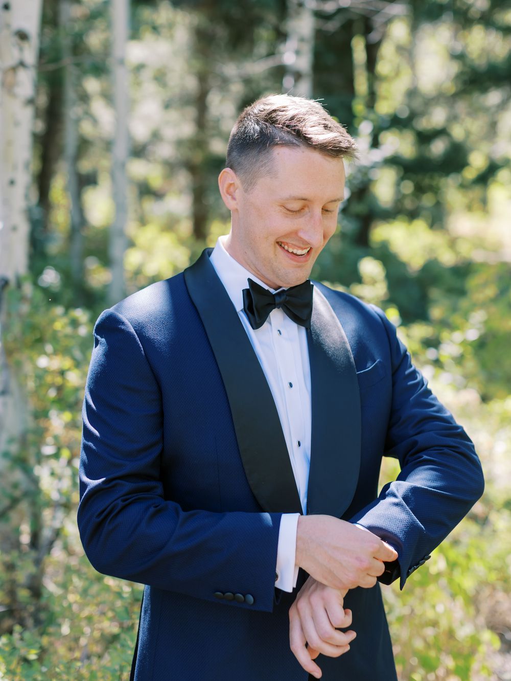 Wedding preparation moments in a sunlit aspen forest setting.