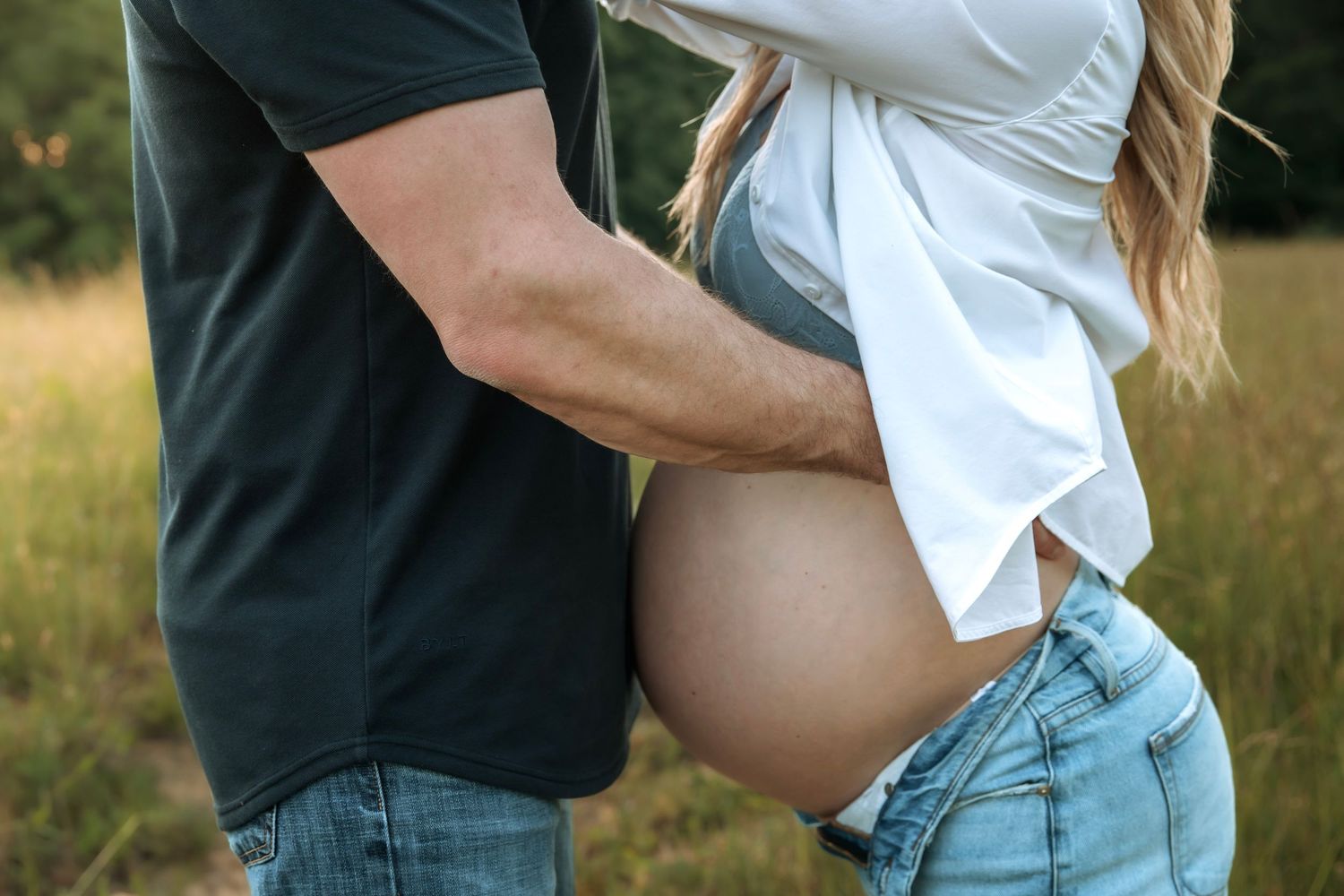 Field maternity session capturing timeless motherhood moments