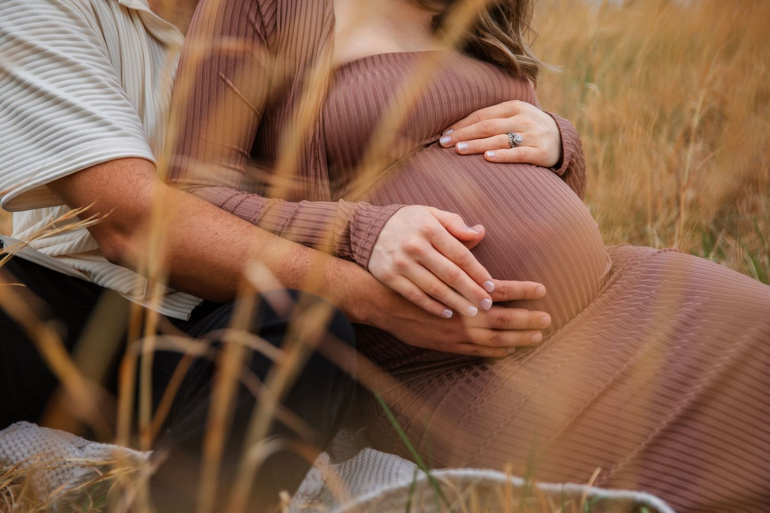 Outdoor maternity photo in golden field near Nashville Tennessee