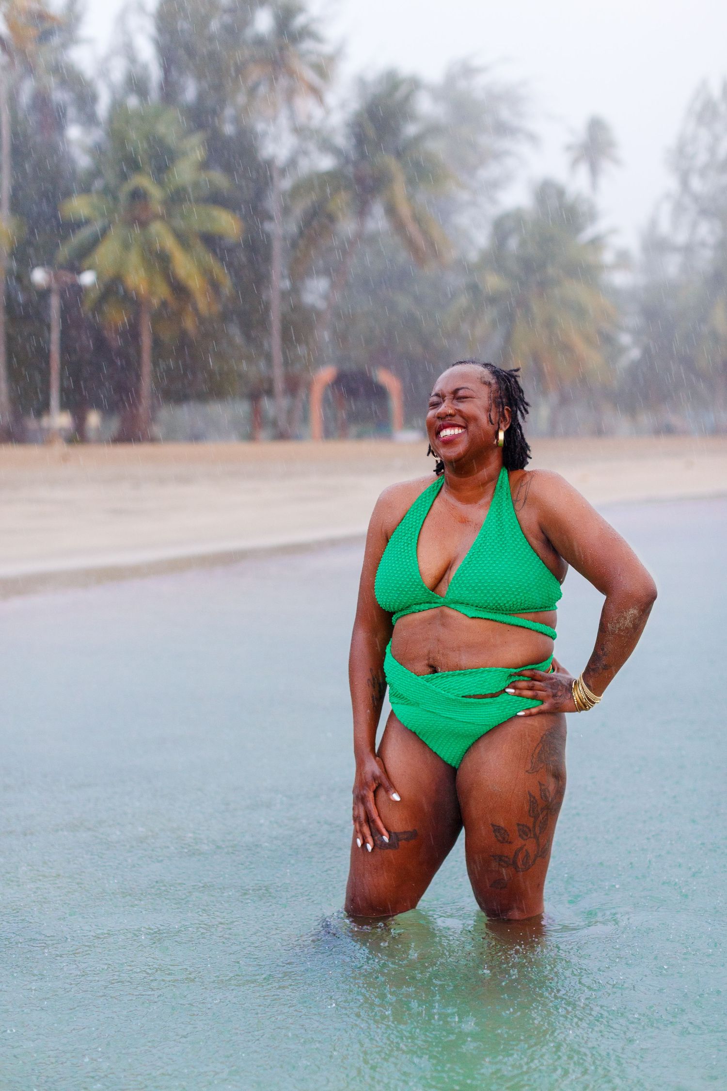 Portrait of a woman at the beach in the rain in Luquillo, Puerto Rico.