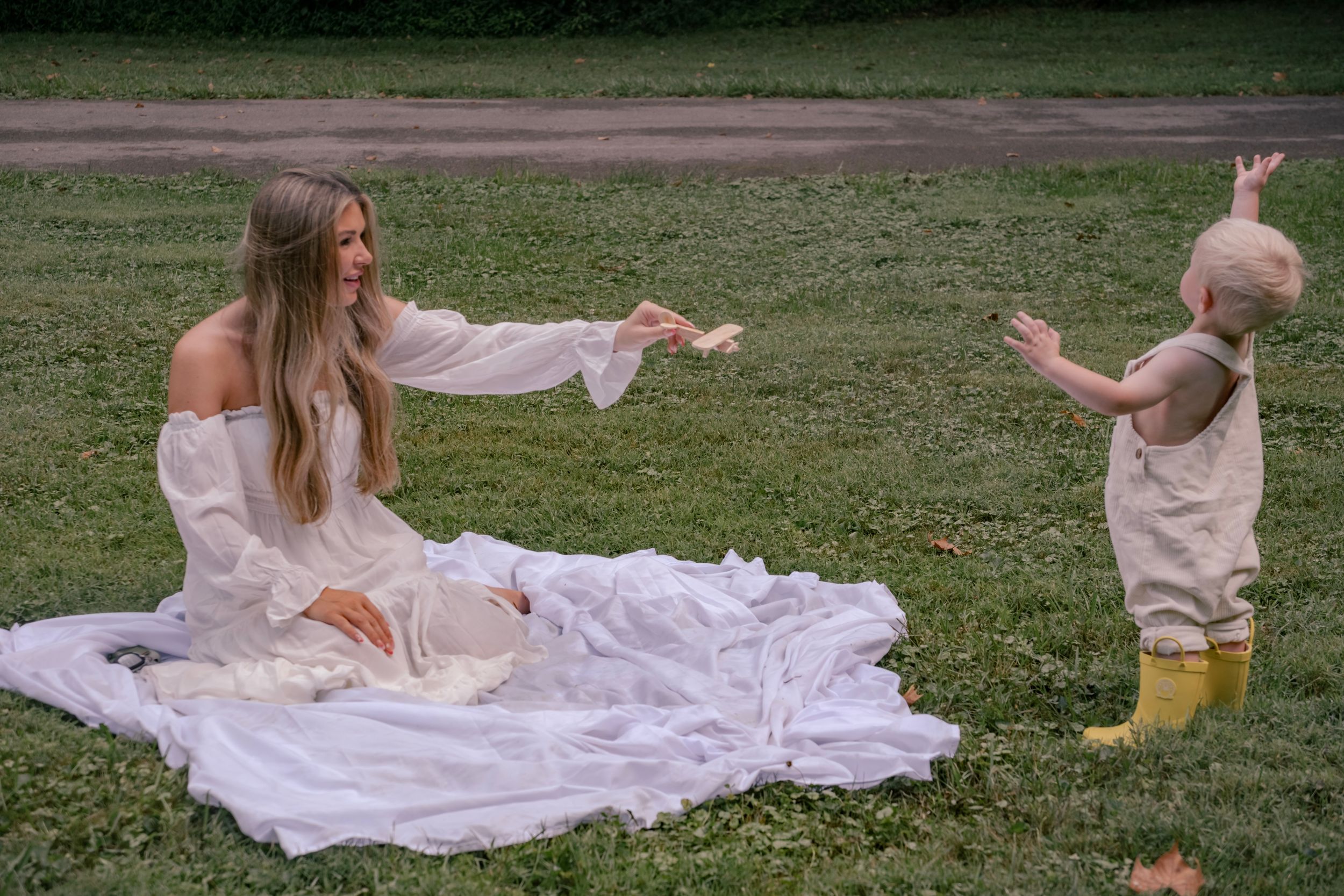 A picnic setting with white blanket spread on grass with joyful moments captured.

Pittsburgh, PA
