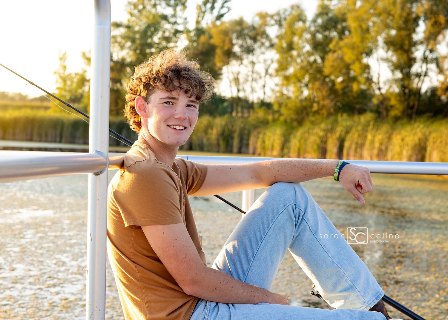Young couple relaxes together on an outdoor deck swing during a golden sunset.