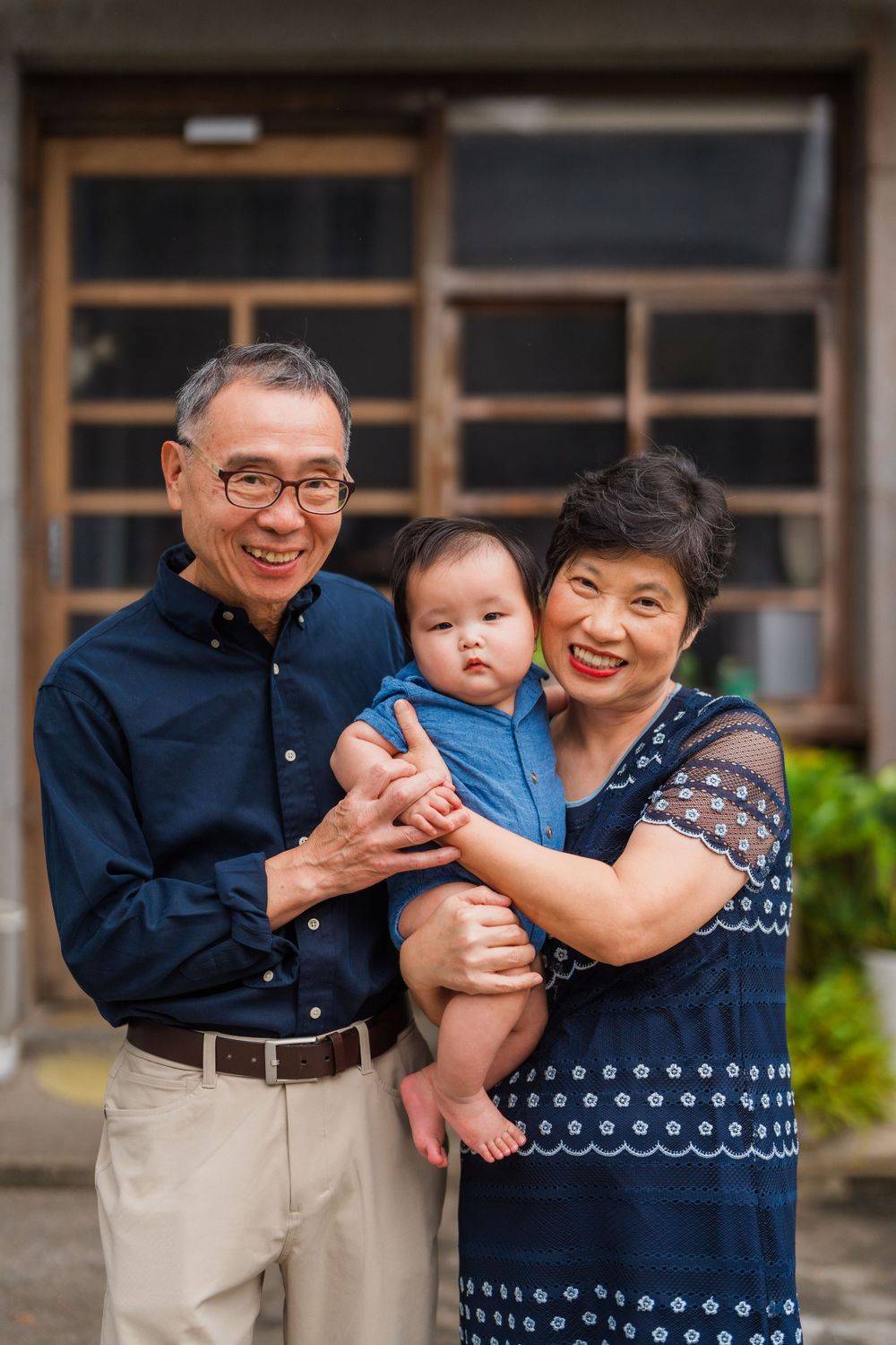 Gramps with a newborn baby at Huashan 1914 Creative Park in Taipei City.