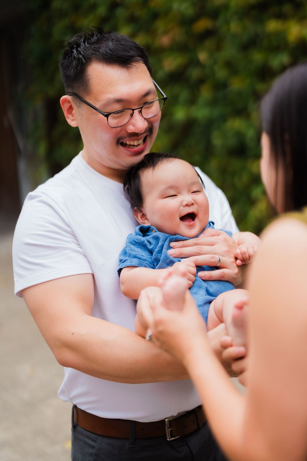 Parents make their newborn baby giggle at Huashan 1914 Creative Park in Taipei City.