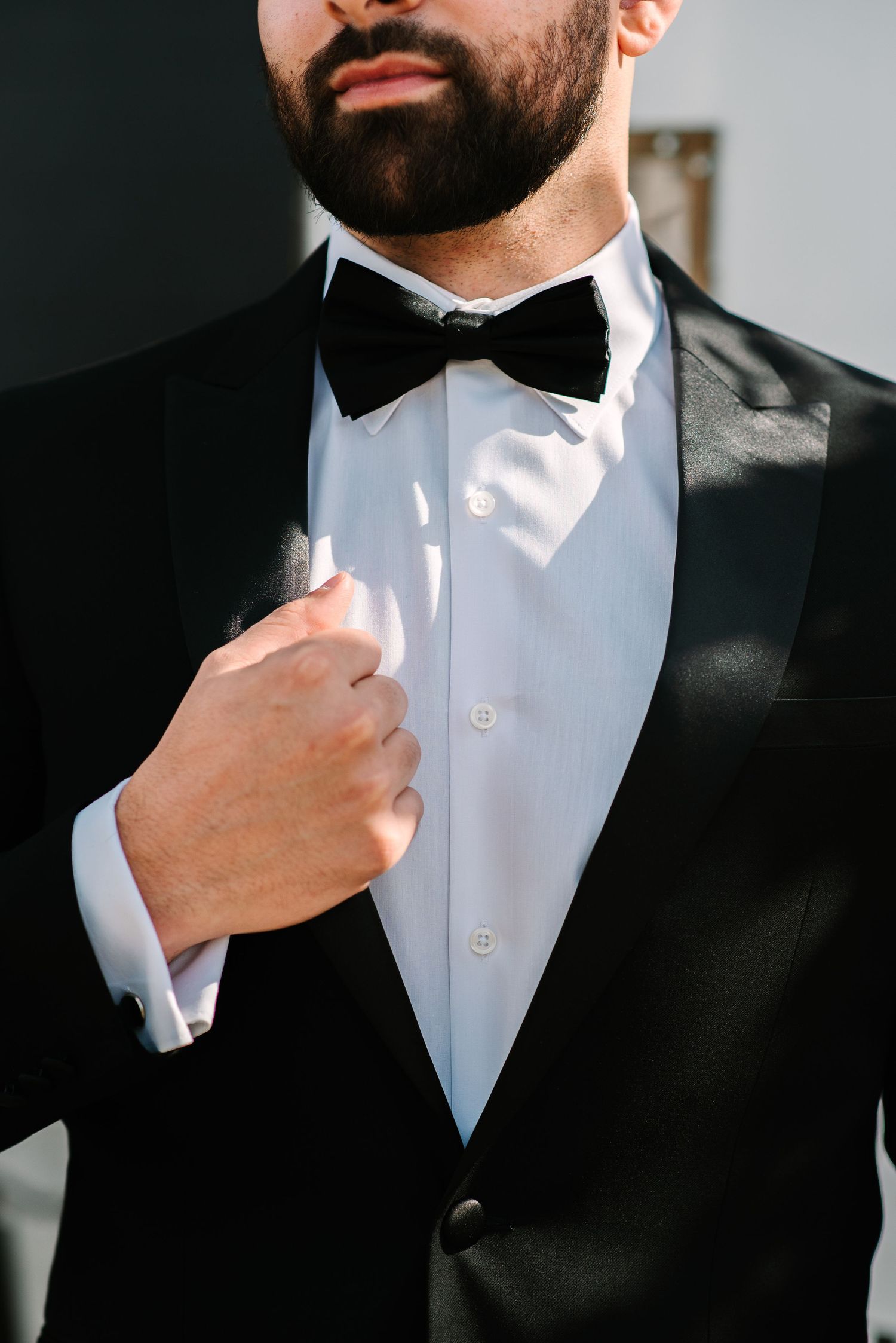 Close up of classic black tuxedo with white shirt and black bow tie.