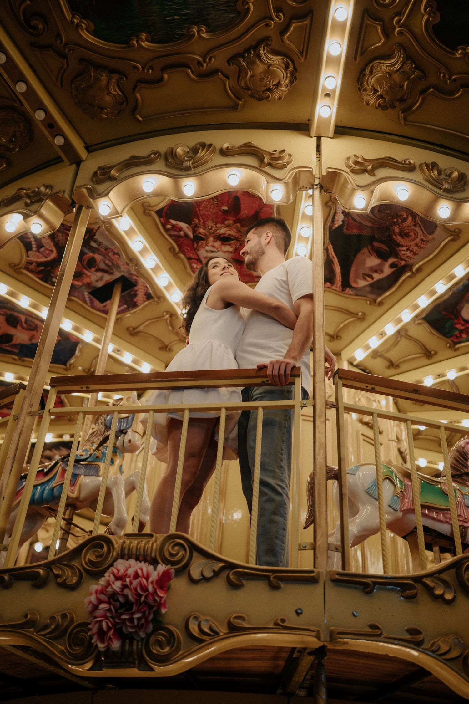 Romantic carousel ride featuring ornate vintage details and glowing lights.