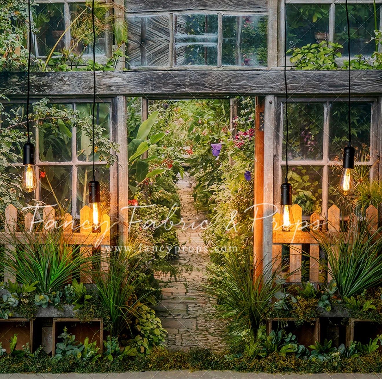Enchanting greenhouse entrance with hanging Edison bulbs, lush tropical plants, and vintage wooden windows surrounded by vibrant greenery.