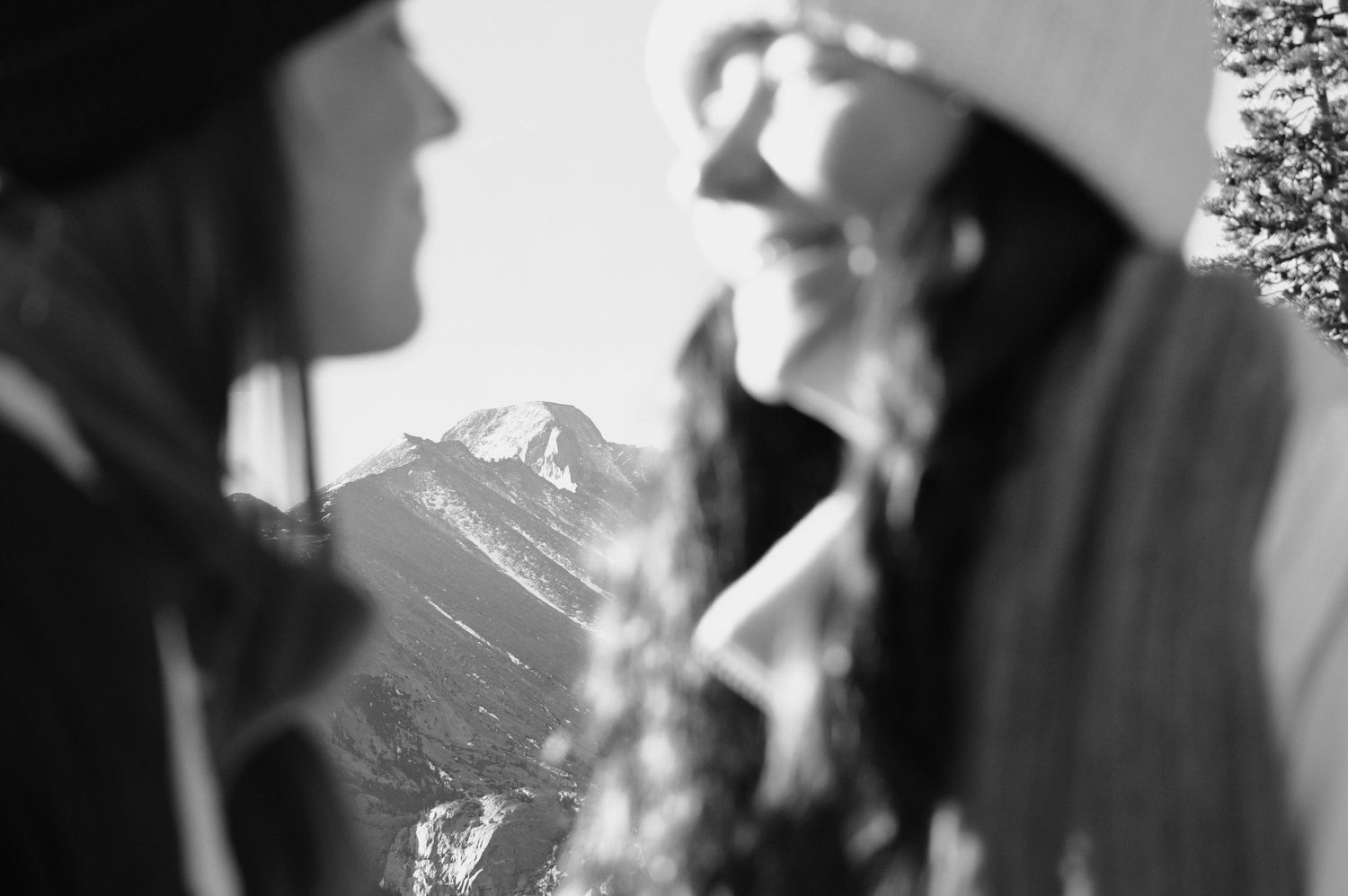 Female couple smiling at each other, full of happiness. She said yes to her proposal. Pixcapades | The Rocky Mountain Proposal Photographer