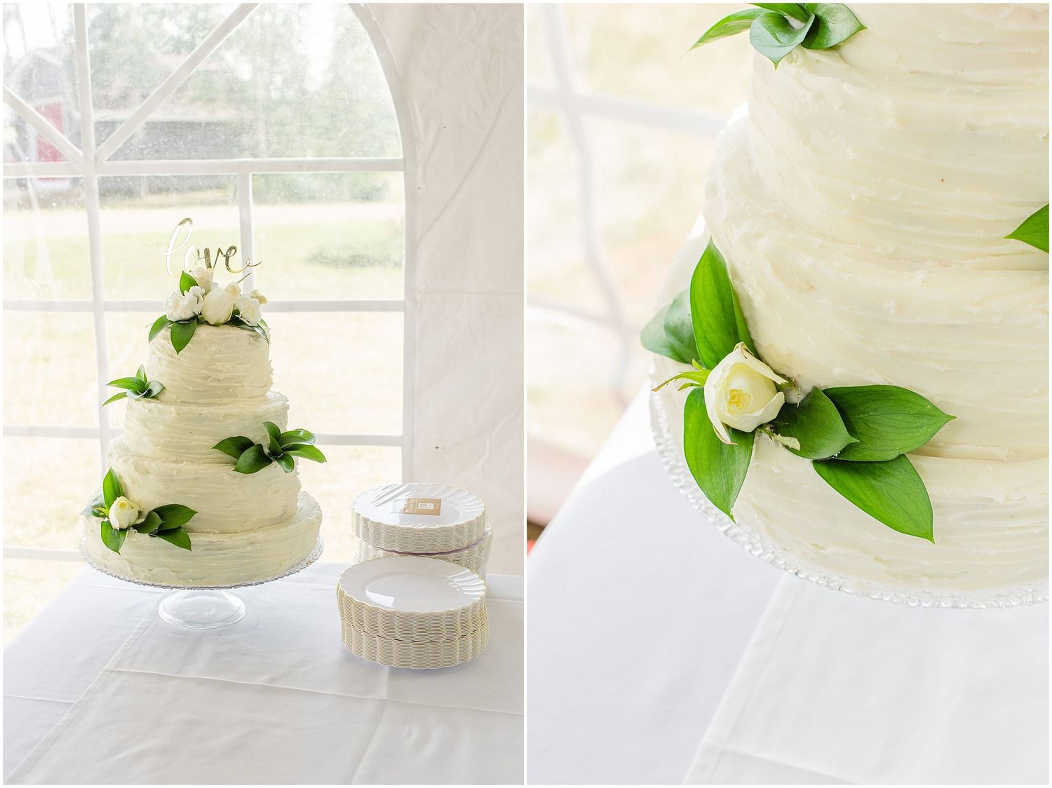 Elegant three-tier white wedding cake adorned with green leaves and white roses on a draped table.