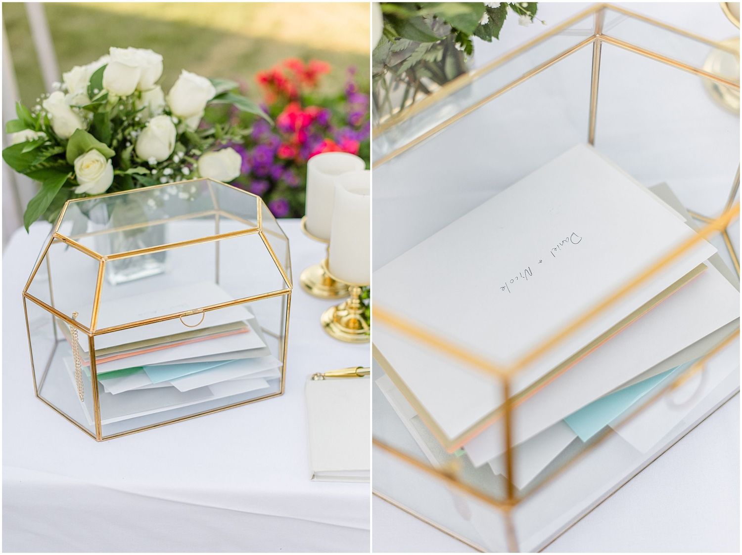 Gold geometric glass card box with wedding cards and white roses centerpiece on outdoor reception table.