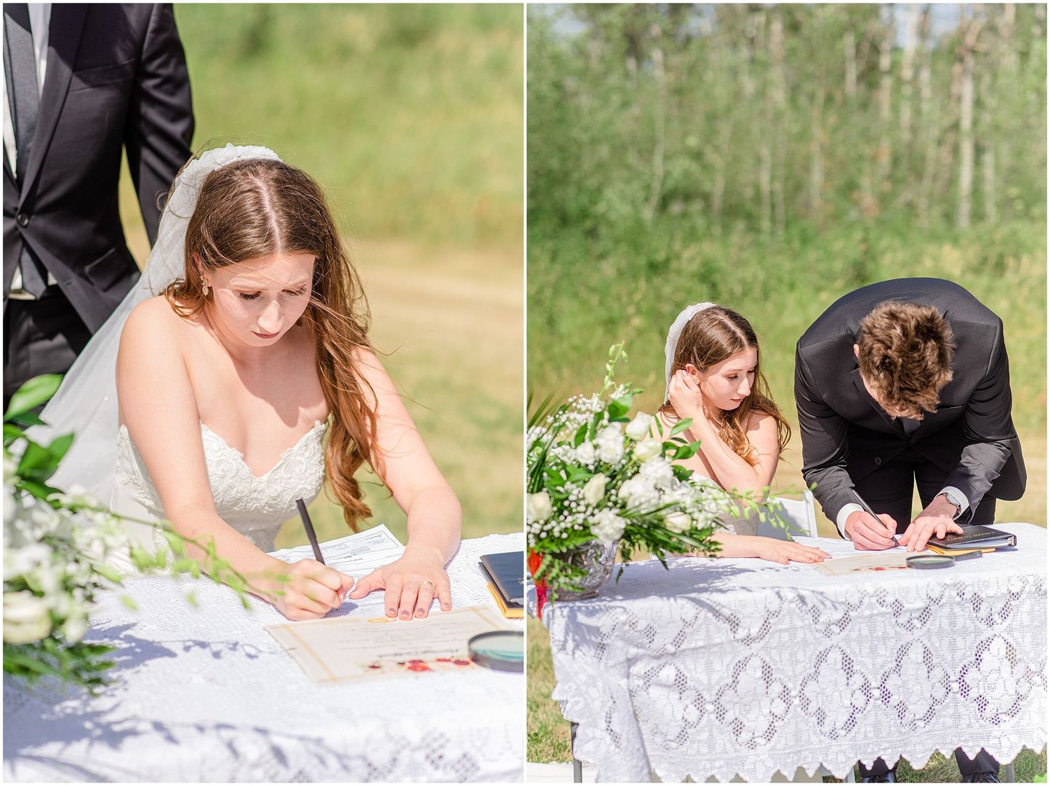 Bride and groom signing wedding register at lace-covered outdoor table with floral arrangement and witness.