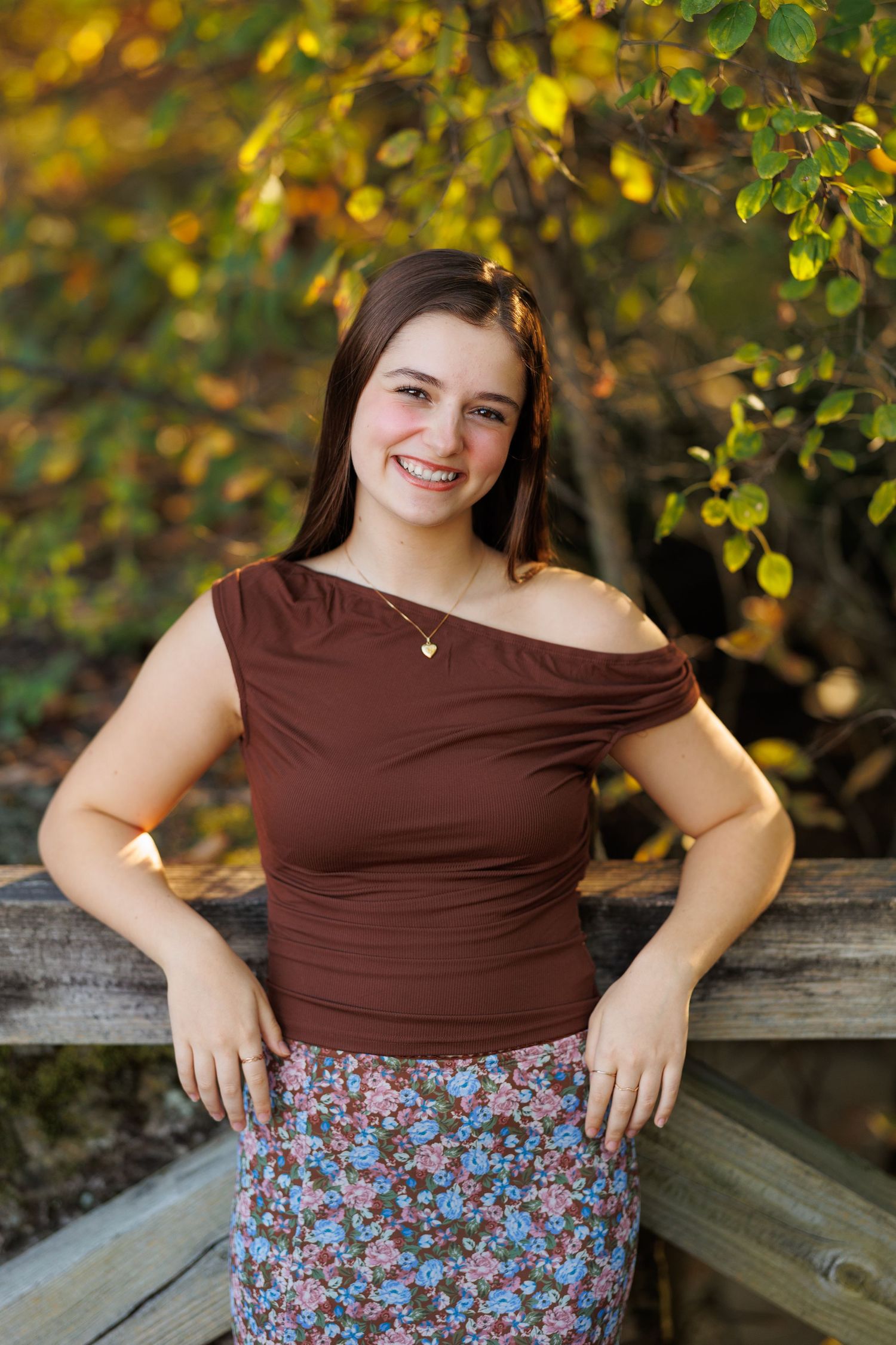 Relaxed outdoor high school senior portrait captured by Tom Forrest Photography at the First and Main area in Hudson, Ohio.