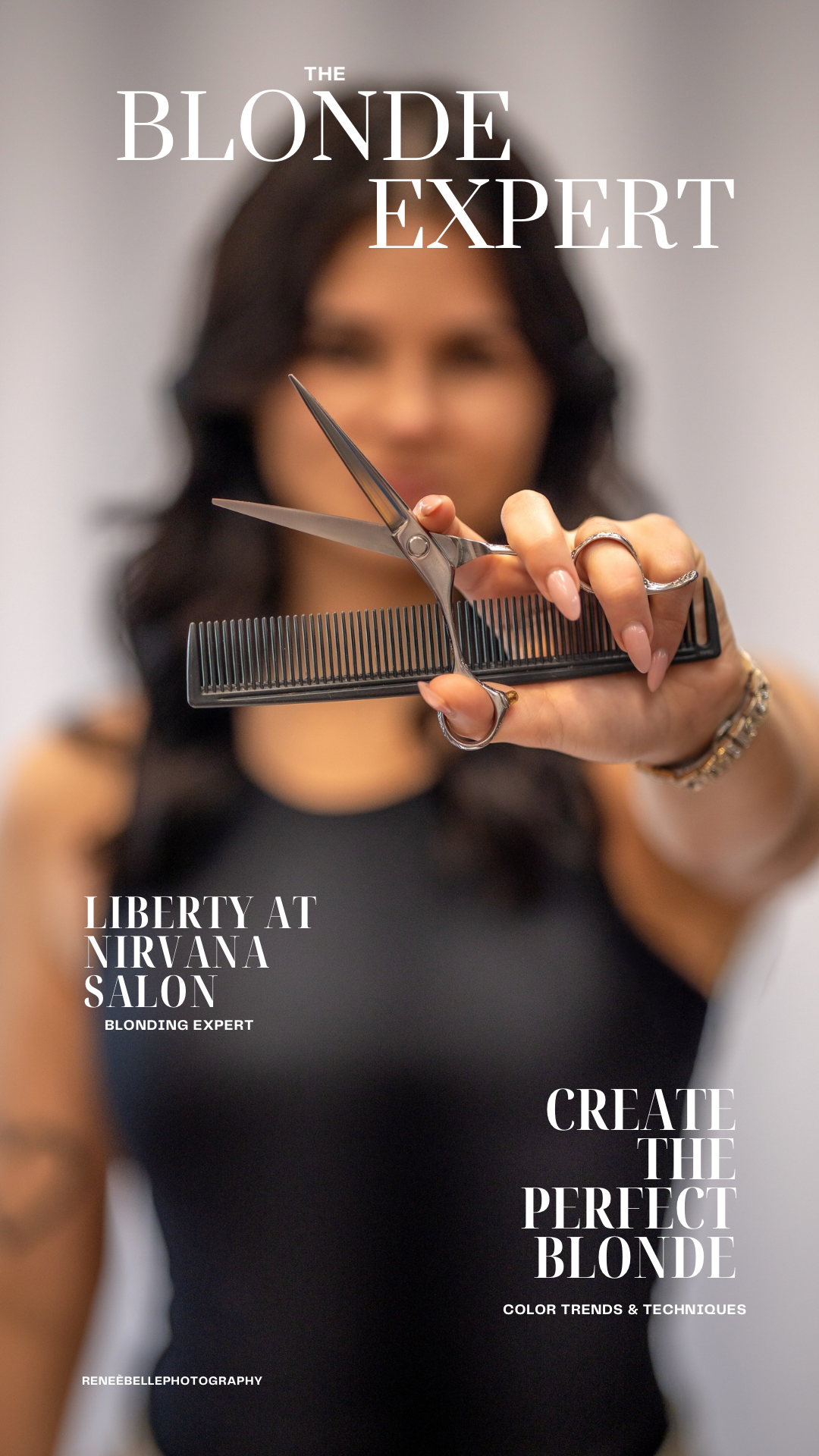 A blonding expert at Nirvana Salon holds scissors and a comb toward the camera in a professional promotional portrait.