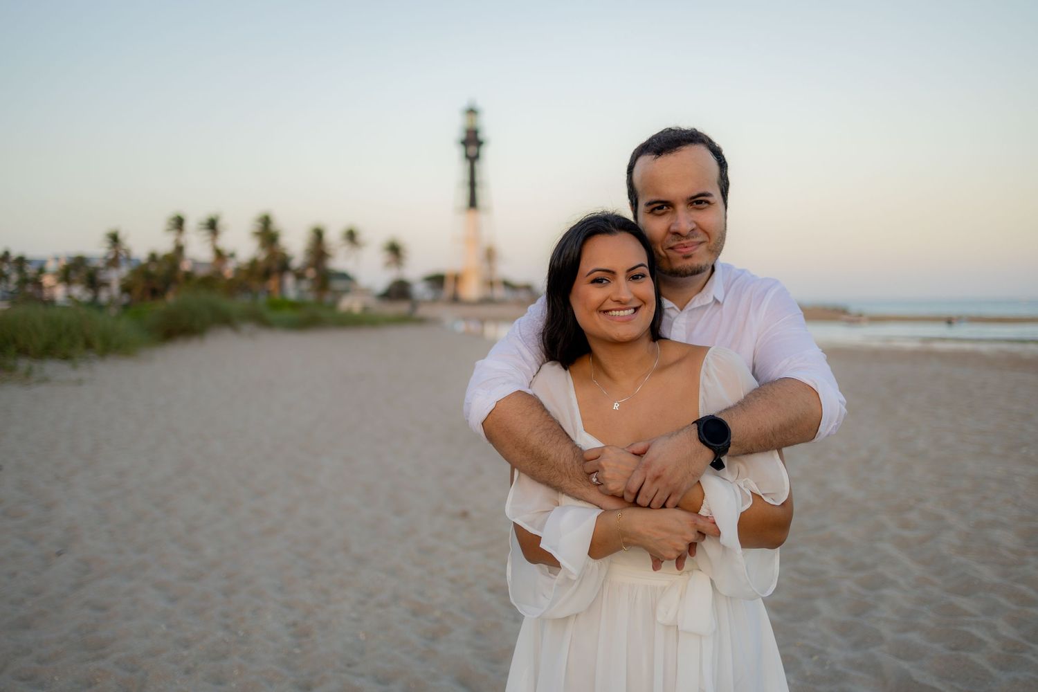 True to style engagement photography at the historic Hillsboro Inlet landmark.