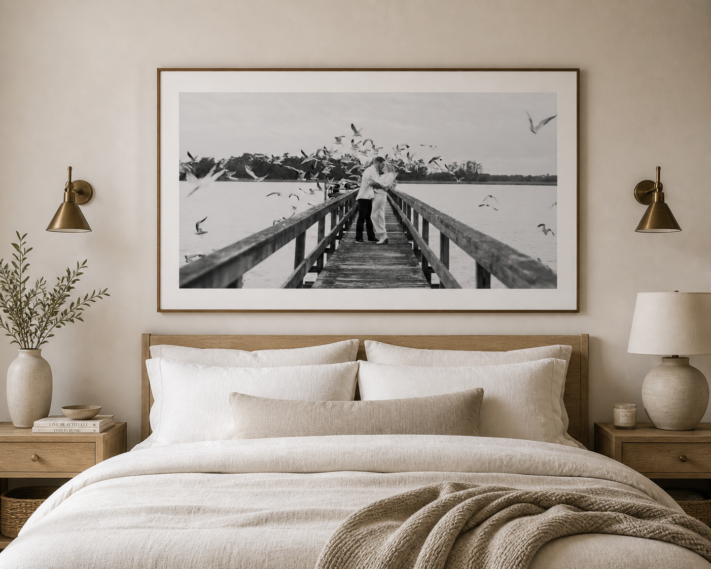 Dramatic and cinematic black and white photography of couple on a wooden pier with seagulls, framed and matted in Beaufort, SC bedroom.