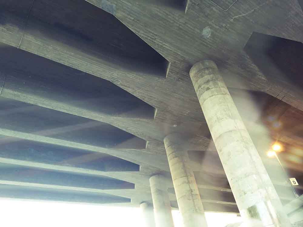 Pillars under a bridge.