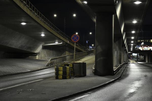 car road, bridge, pillars, tire pile.