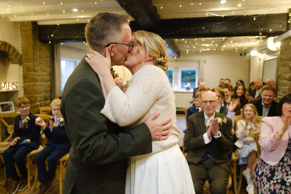 Bride and groom kissing at the black horse, Clifton