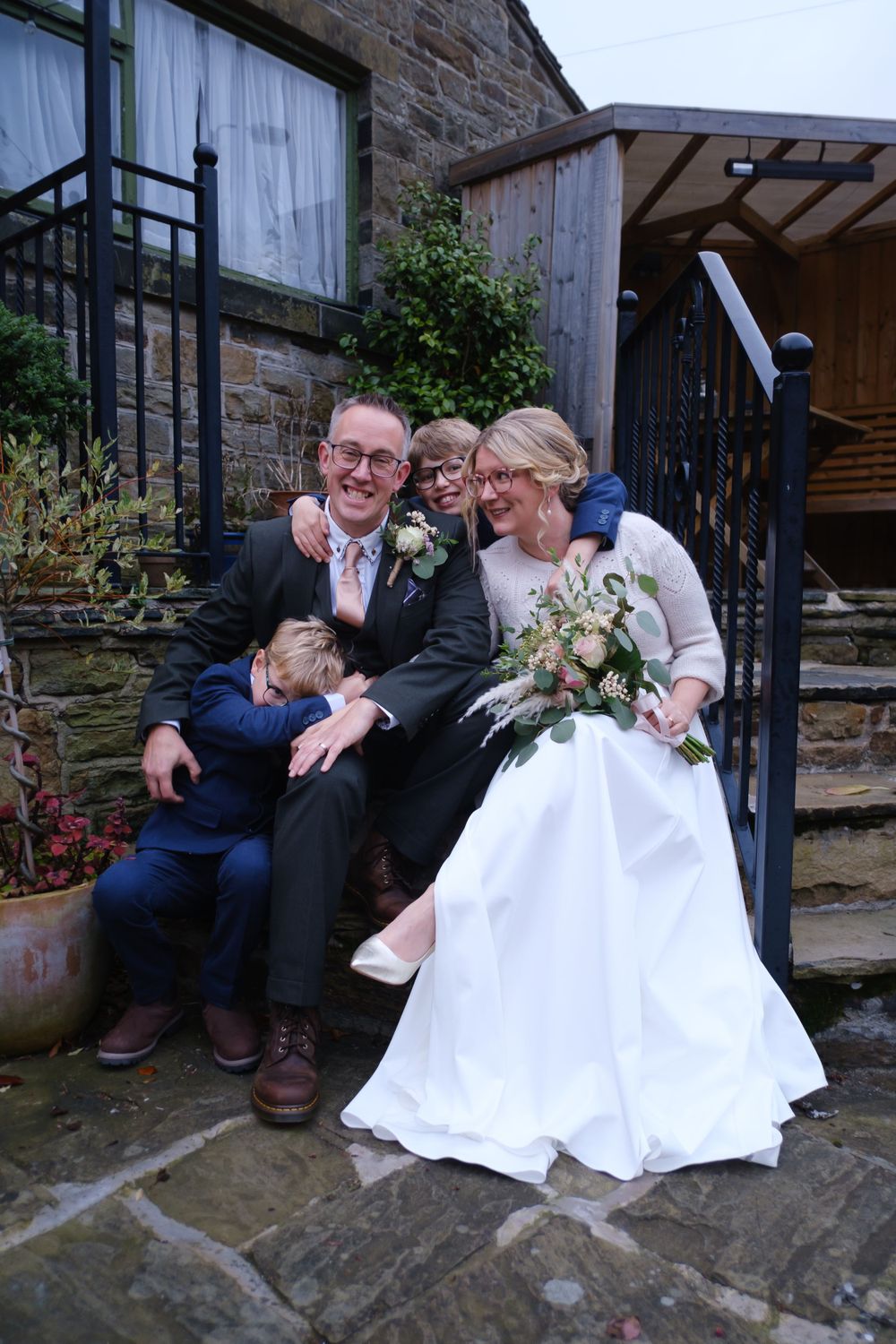 Bride, Groom and Bride's two young sons after th wedding ceremony, The Black Horse, Clifton